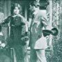 Alice Joyce, Tom Moore, and Hazel Neason in The Finger of Suspicion (1912)