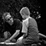 Between scenes, director David Anspaugh confers with Chandler Canterbury, regarding the young actor