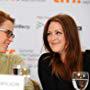 Erin Cressida Wilson and Julianne Moore speaking at the "Chloe" press conference during the Toronto Film Festival. 