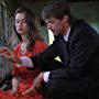 The Detective (Leandro Lefa) and The Woman in Red (Carolina Silvestre) search the mind of the deceased Studio Head (Isidoro B. Guggiana). 