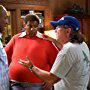 Bill Cosby and director Joel Zwick review a scene with Kenan Thompson on the set of FAT ALBERT.
