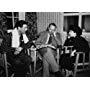 Elizabeth Taylor, director Victor Saville and Robert Taylor going over the script of "Conspirator"