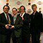 Presenters Jennifer Taylor Lawrence and Crispin Freeman flank Best Home Entertainment Production winners Peter Avanzino, David X. Cohen, Matt Groening