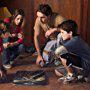 Kristen Stewart, Dax Shepard, Josh Hutcherson, and Jonah Bobo in Zathura: A Space Adventure (2005)