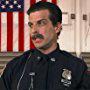 Mitch Rouse as Officer Sivilian from "Stranger