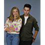 Sarah Chalke and Glenn Quinn in Roseanne (1988)