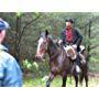 Brian Danner as DP Upham in Aftershock. (riding Blaze)