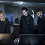 Joe Dinicol, Rick Gonzalez, David Ramsey, and Emily Bett Rickards in Arrow (2012)