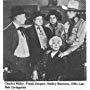 Smiley Burnette, Frank Jaquet, Effie Laird, Robert Livingston, and Charles Miller in Beneath Western Skies (1944)