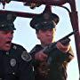G.W. Bailey and Lance Kinsey in Police Academy 4: Citizens on Patrol (1987)