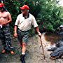 Director Paul Sullivan discusses a scene with Chris Elliott as alligator wrangler Tim Williams watches on.