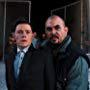 Noel Gugliemi and Burn Gorman in The Dark Knight Rises (2012)