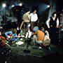 Paul McCartney, John Lennon, Neil Aspinall, Geoff Emerick, Mal Evans, George Harrison, Michael Lindsay-Hogg, Yoko Ono, Ringo Starr, and The Beatles in Let It Be (1969)