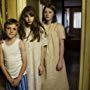 Fern Deacon, Eleanor Worthington-Cox and Elliot Kerley in The Enfield Haunting