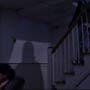 Lolita (Christy Scott Cashman) sleeps on a recliner oblivious to the looming shadow cast by Judd (Eric Scheiner) as he descends the stairs in a scene from filmmaker Angel Connell
