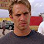 Thom Barry and Paul Walker in 2 Fast 2 Furious (2003)