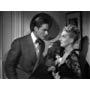 Errol Flynn and Lee Patrick in Footsteps in the Dark (1941)