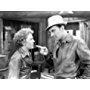 George Brent and Beverly Roberts in God