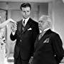 Olivia de Havilland, Dick Powell, and Charles Winninger in Hard to Get (1938)