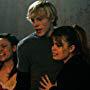 Stars Trevor Duke as Derek Cowley and Kimberly J. Brown as Sam (center and right) and Jennifer Roa as Breanna react to a friend meeting a grisly demise at the claws of the Beast.