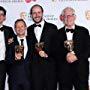 George Ormond, Marc Munden, Jack Thorne and John Chapman at BAFTAs 2017. Best MiniSeries for National Treasure.
