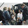 Matthew McConaughey (second from left) chats with the crew during a break in filming. Directed by Rob Bowman.