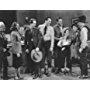 John Wayne, Burr Caruth, Ray Corrigan, Kirby Grant, Lorna Gray, Robert McKenzie, Sammy McKim, Max Terhune, and Elmer in Red River Range (1938)