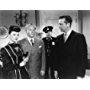 Steven Geray, Dick Powell, and Nina Vale in Cornered (1945)