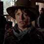 Michael J. Fox, Christopher Lloyd, and Matt Clark in Back to the Future Part III (1990)