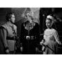 Janet Blair, Louis Hayward, and George Macready in The Black Arrow (1948)