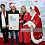 Erik Estrada, Laura McKenzie, and Bret Michaels at an event for 88th Annual Hollywood Christmas Parade (2019)