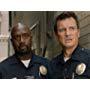 Nathan Fillion and Richard T. Jones in The Rookie: Impact (2019)