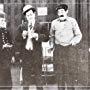 Bobby Burns, Walter Kendig, and Walter Stull in He Was a Traveling Man (1915)