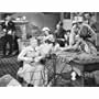 Lee Bennett, Johnny Carpenter, Eddie Dean, Jennifer Holt, Lash La Rue, Emmett Lynn, Sarah Padden, and Don Williams in Song of Old Wyoming (1945)