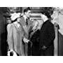 Errol Flynn, Allen Jenkins, and Brenda Marshall in Footsteps in the Dark (1941)