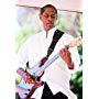 Tim Russ playing guitar