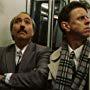 Alex Cox and Miguel Sandoval in Three Businessmen (1998)