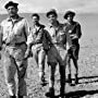 Charles Aznavour, Maurice Biraud, Germán Cobos, and Lino Ventura in Taxi for Tobruk (1961)