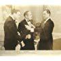 William Gargan, John Hubbard, and Adolphe Menjou in Turnabout (1940)