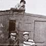 Robyn Adair, Rex Downs, Glen Gano, and Helen Holmes in A Perilous Chance (1915)