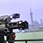 Director Rian Johnson sets up a shot on the famous Bund (boardwalk) in Shanghai, China for his Sci-Fi hit "Looper". 