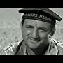 Maurice Biraud in Taxi for Tobruk (1961)